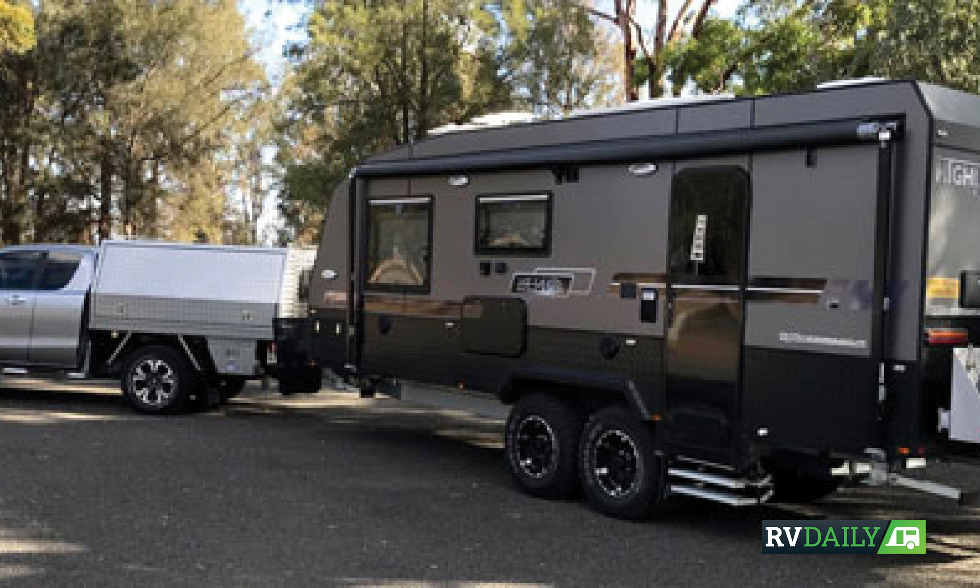 A large caravan behind a ute