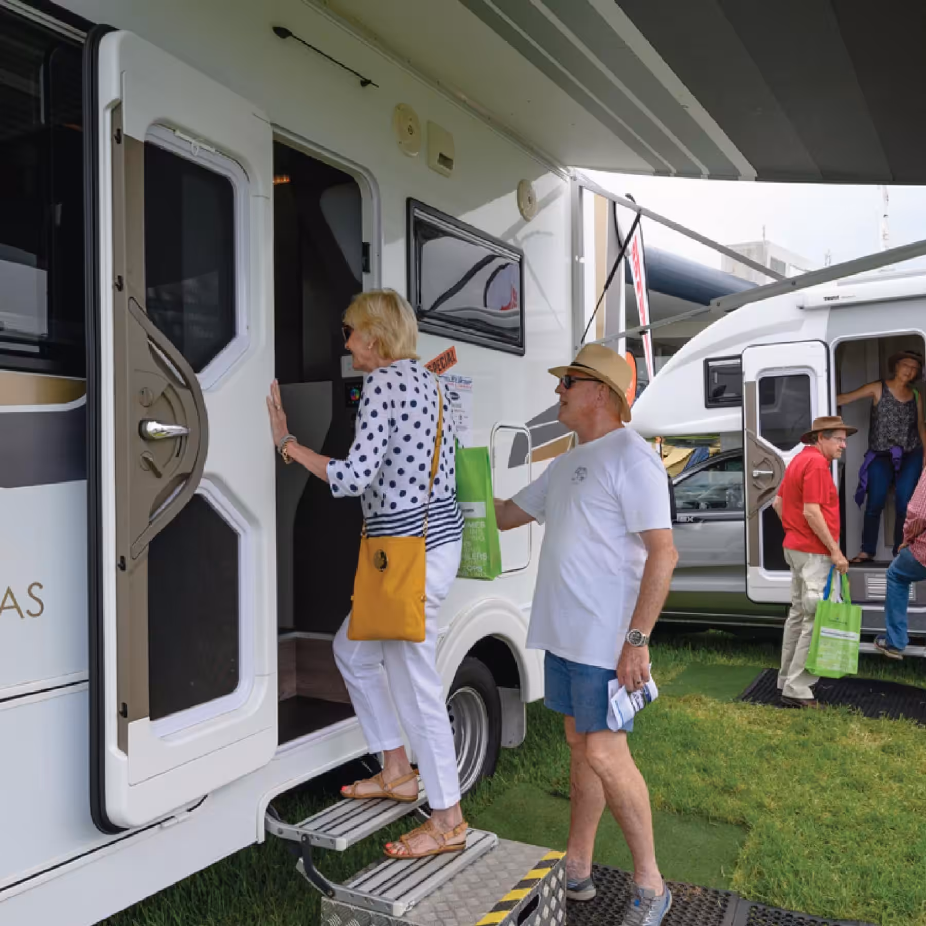 A couple checking out the inside of a caravan