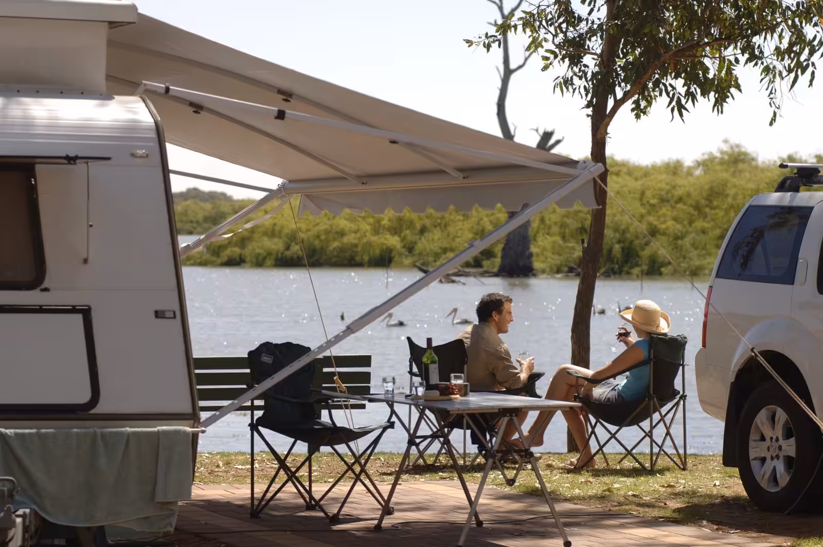 Couple under caravan awning