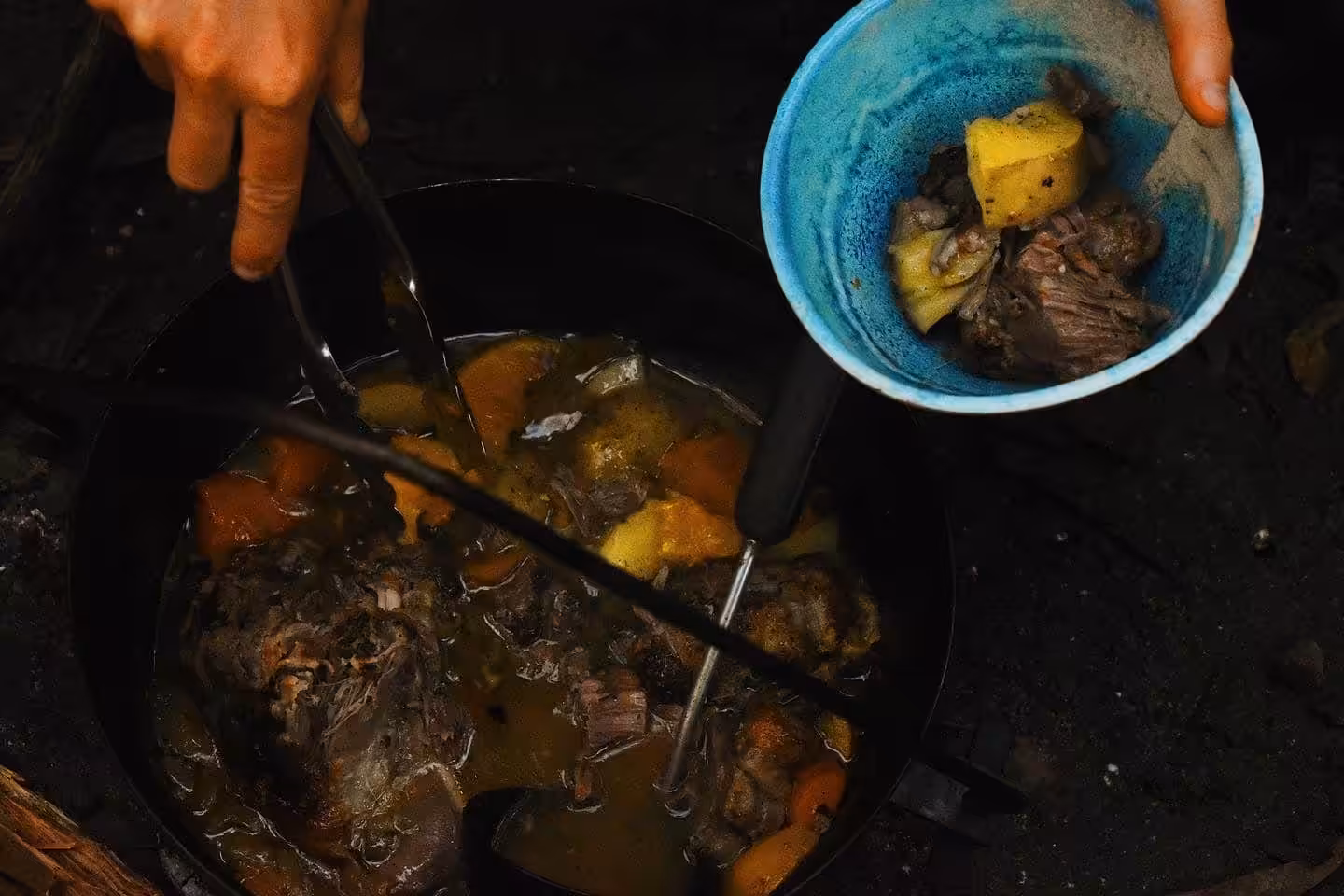 Slow cooked beef stew camping meals in camp oven