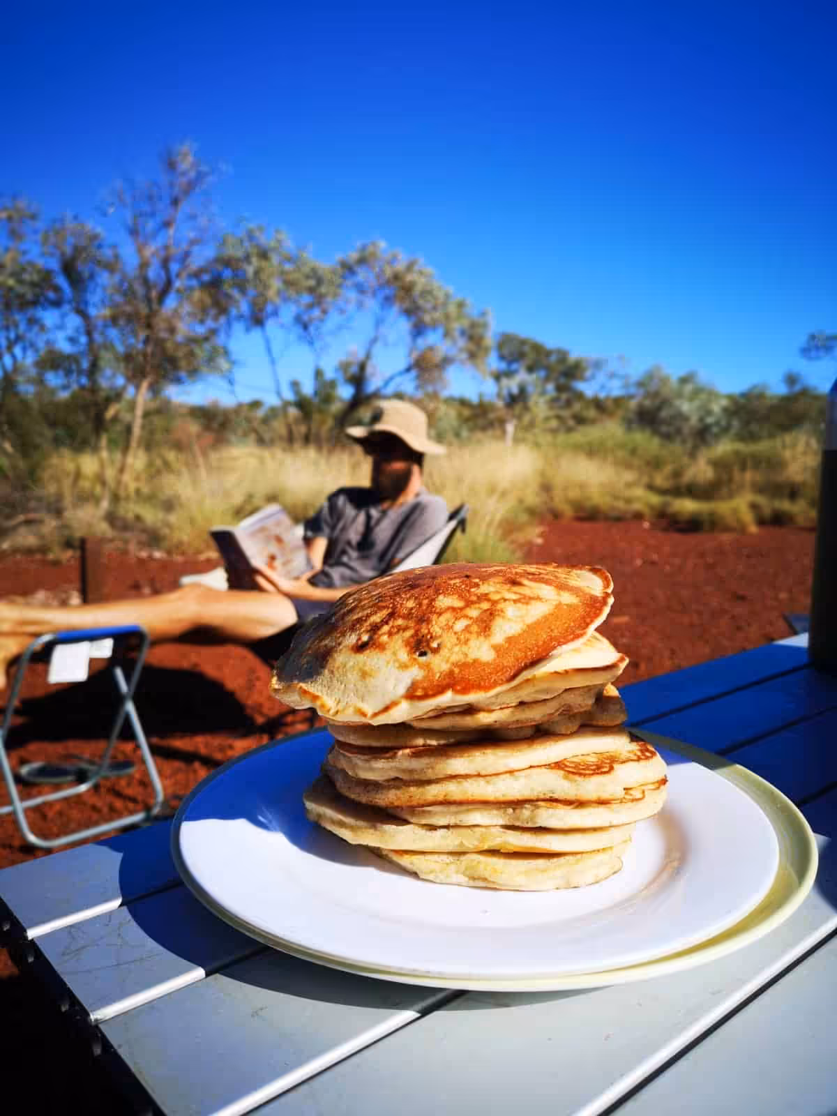 Banana pancakes cooking in a pan