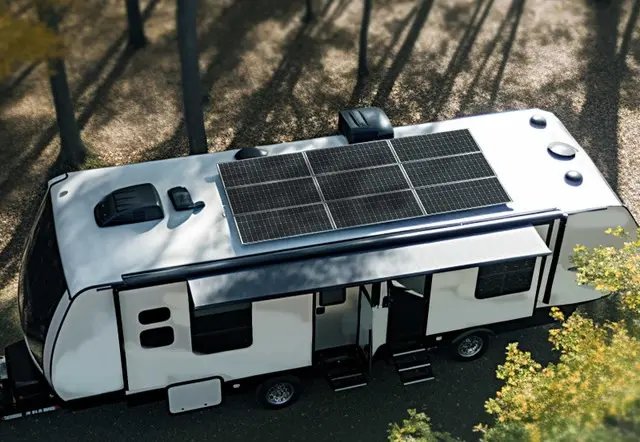 Caravan solar panels: A rigid Renogy solar panel array mounted flat on an RV roof