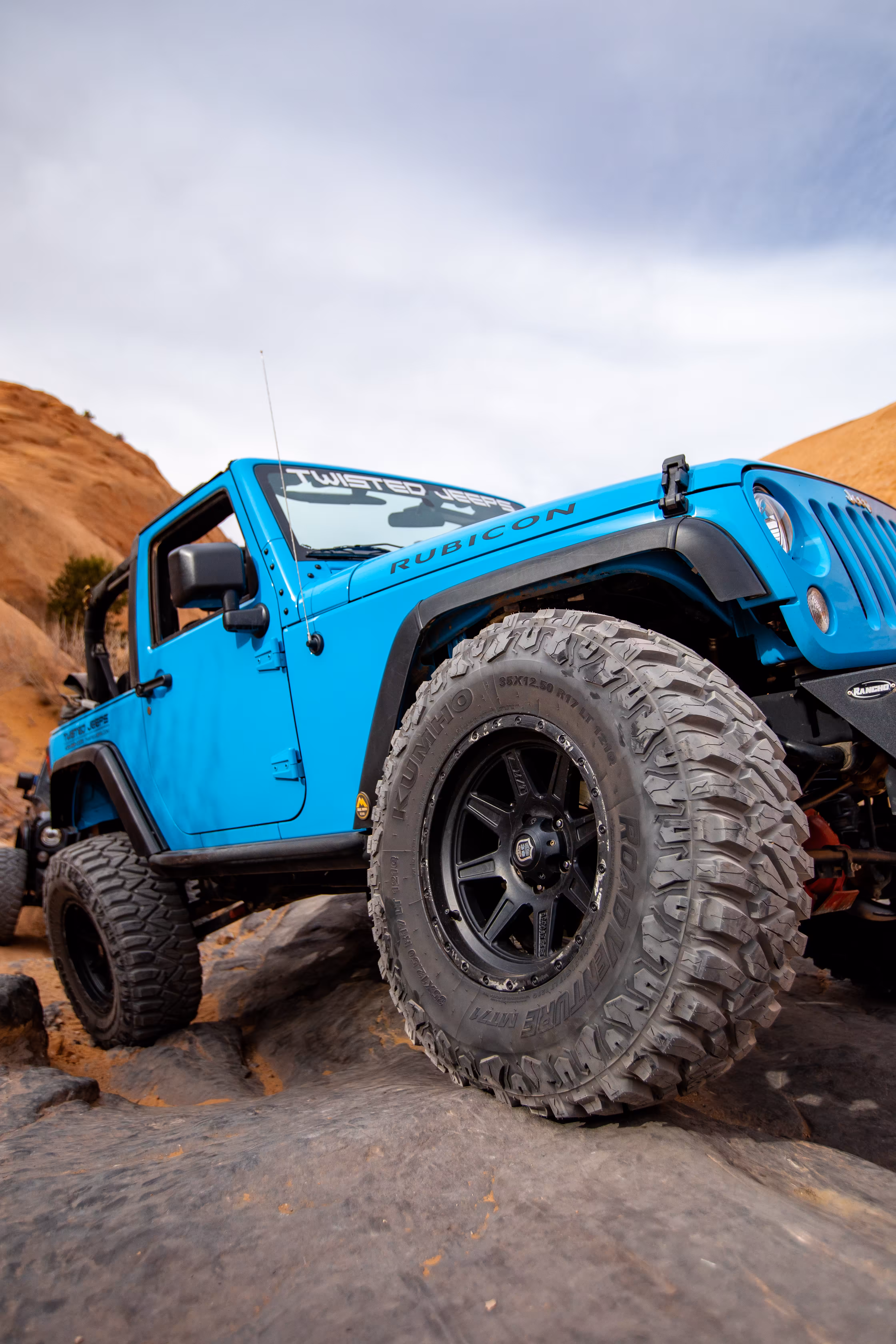 Close up of a mud terrain tyre on a jeep. 