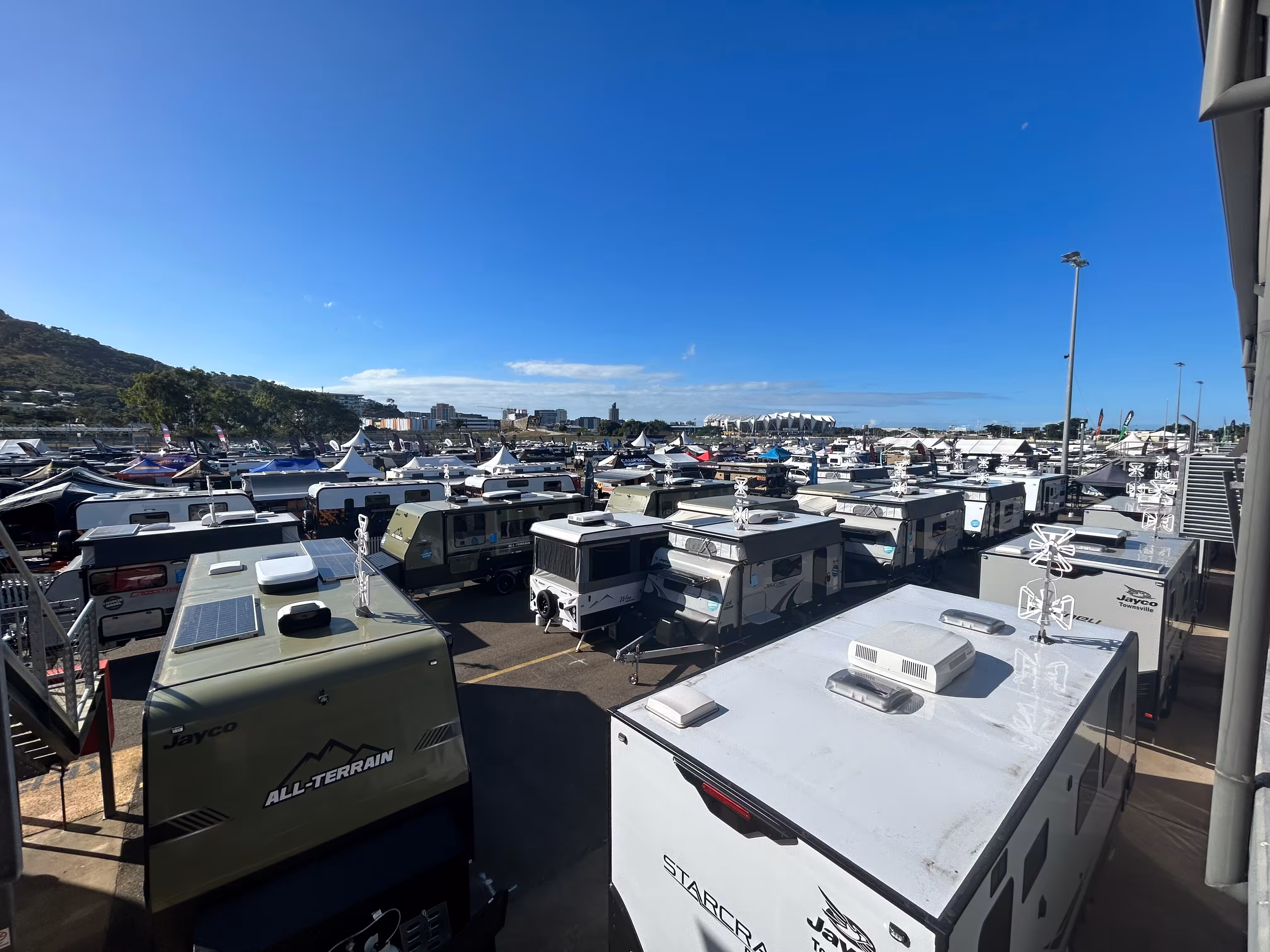 A sea of caravans at an outdoor expo.
