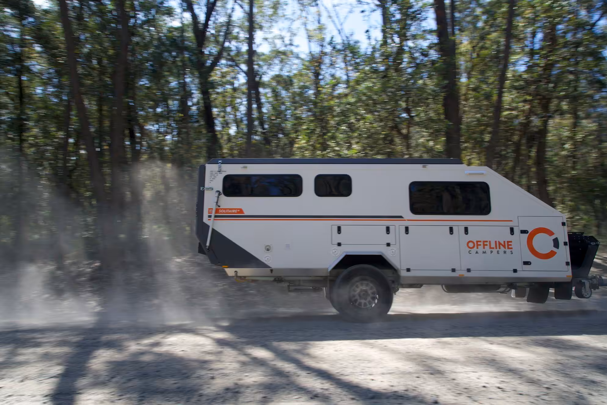 Solitaire 16 hybrid camper interior showing queen bed and luxury fittings