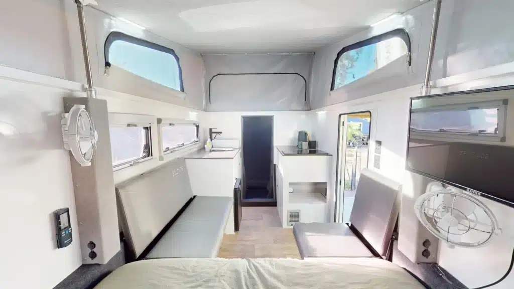 Solitaire 16 hybrid camper kitchen slide-out showing accessible storage