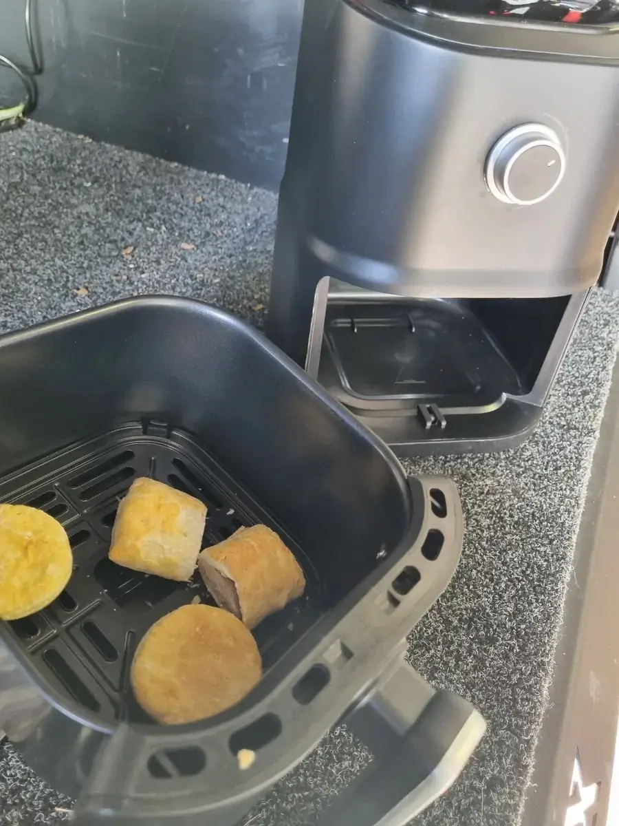 road chef 12v air fryer on outdoor camp table with cooked food