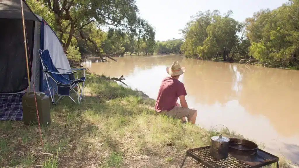 Camping by the river in an outback station stay