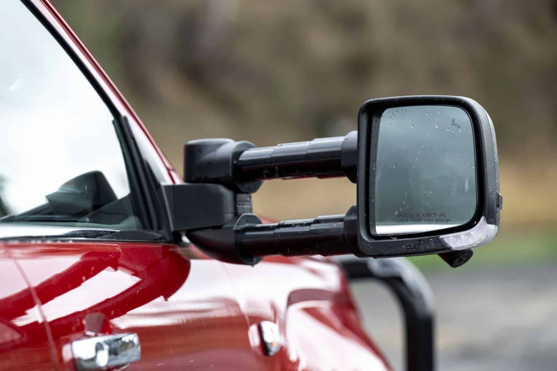 Driver view: A driver checking their Clearview towing mirror while reversing a caravan