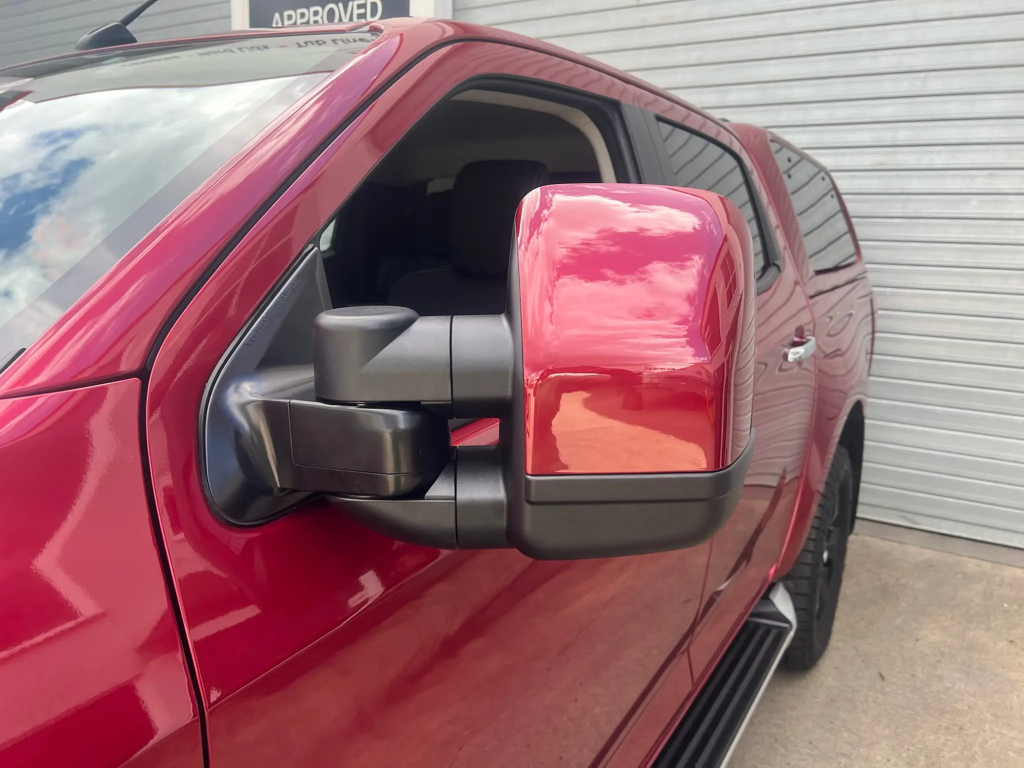 Colour Coded Mirror: Front view of a white towing mirror matching the vehicle body colour