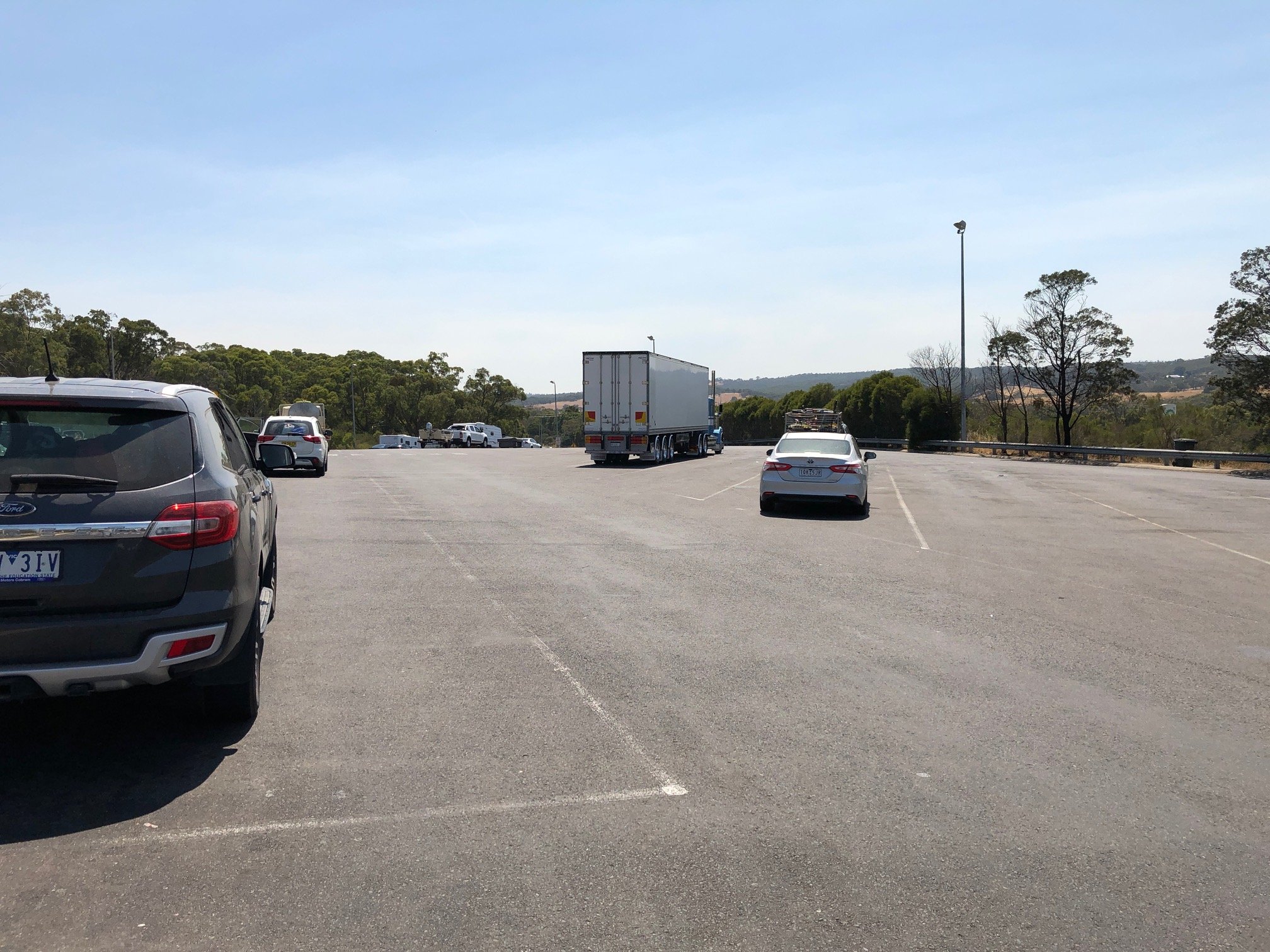 A Day At Bp Northbound In Wallan, Victoria With Cars Parked In The Truck Bays