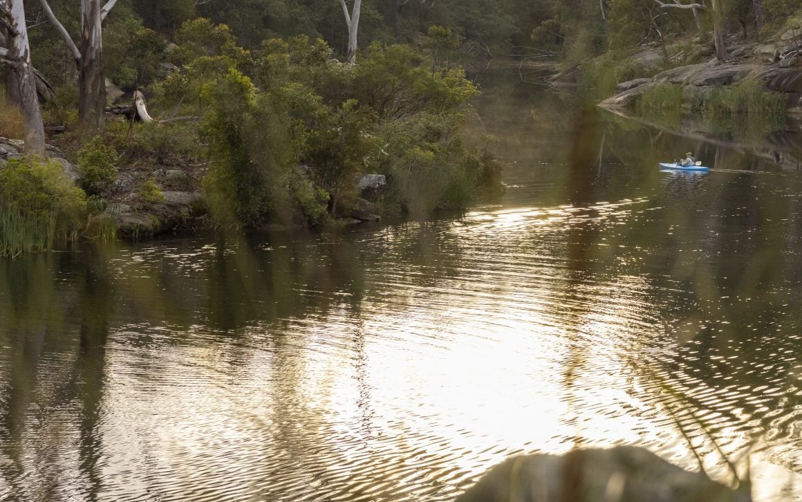 Man fishing from his kayak along the Parramatta River, Parramatta. Copyright Destination NSW.